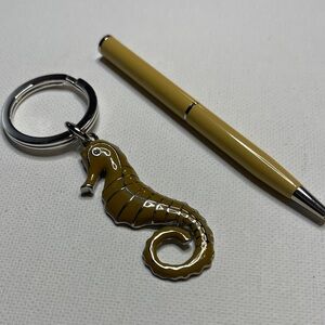 Coach Seahorse Keychain - Tan Coach pen
